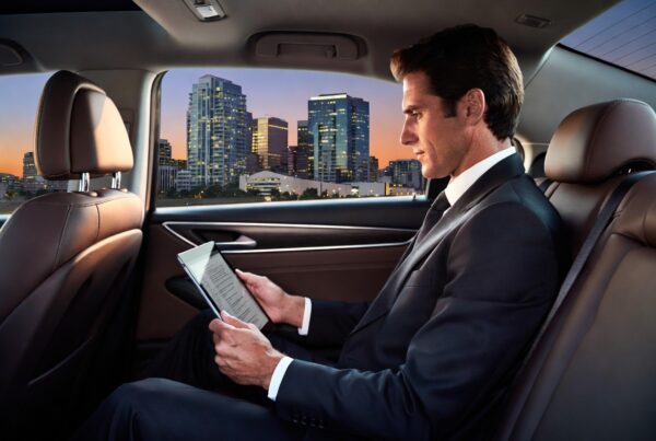 Corporate travel manager arranging black car ground transportation in Phoenix and Scottsdale